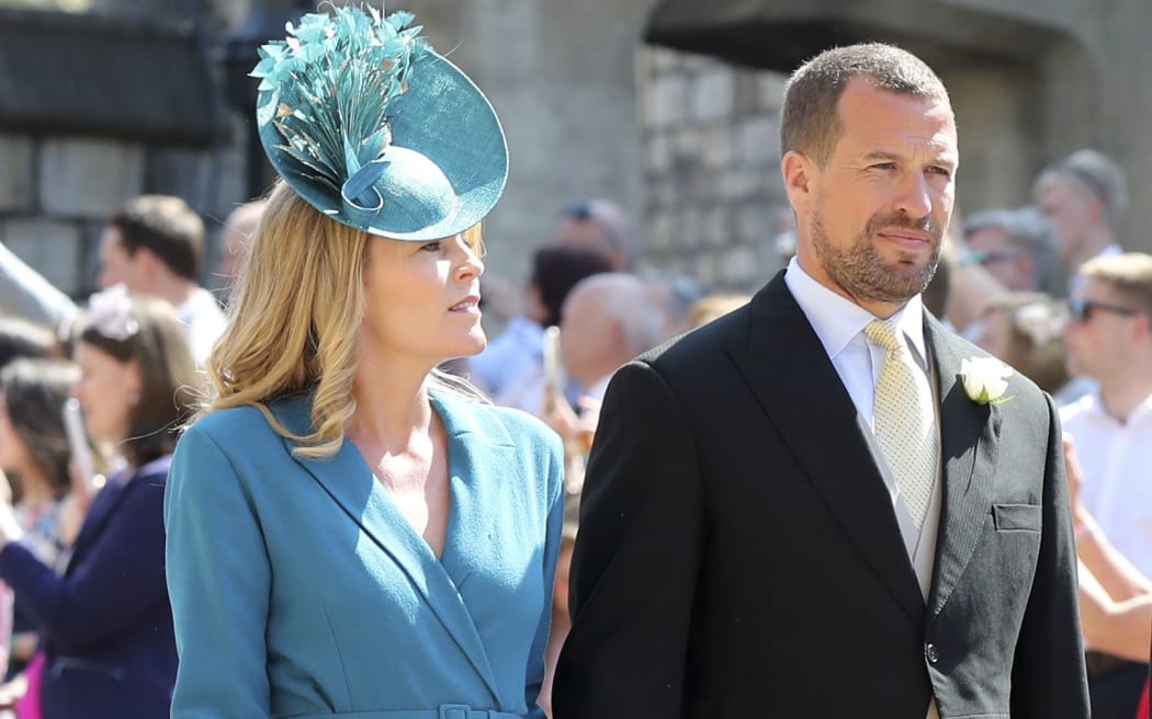 Peter Phillips and Autumn Phillips arrive for the wedding ceremony of Britain's Prince Harry, Duke of Sussex and US actress Meghan Markle at St George's Chapel, Windsor Castle, in Windsor.
