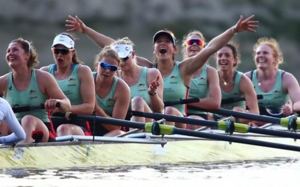 Oxford University celebrate their victory in the annual boat race against Cambridge on the Thames.