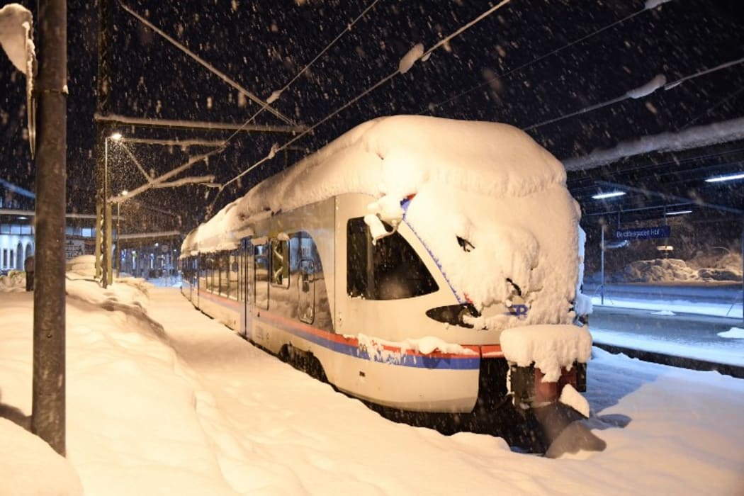 A commuter train  at the station of Berchtesgaden, southern Germany, on January 10, 2019, where rail transport stopped due to heavy snowfalls.