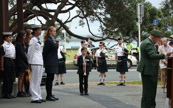 Celine waiting to perform at a Remembrance Service in 2024