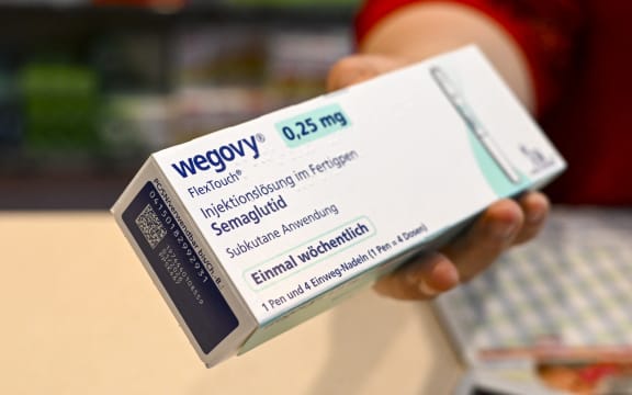 11 July 2024, Berlin: Wegovy" brand slimming syringes are sold in the Achat pharmacy in Mitte. Photo: Jens Kalaene/dpa (Photo by JENS KALAENE / DPA / dpa Picture-Alliance via AFP)
