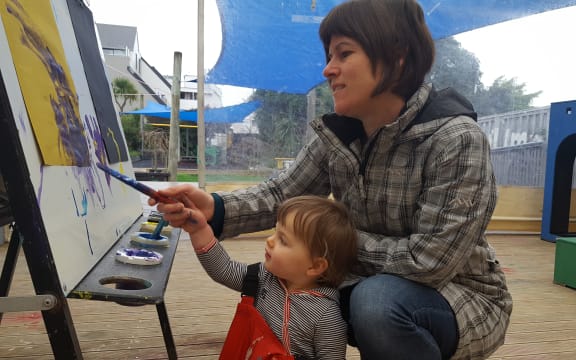 Fiona Roberton helps her daughter Kate (17-months) paint at Newtown Playcentre.