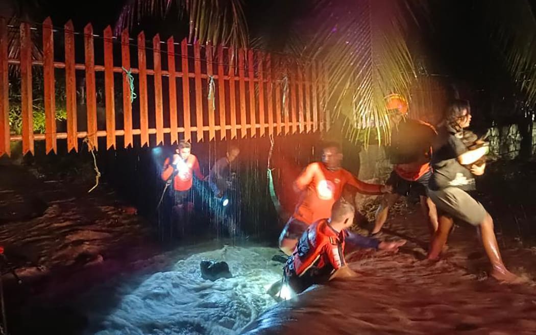 Thousands fled their homes in Ozamiz city, as Christmas Day floods dampened the mainly Catholic Philippines's most important holiday.