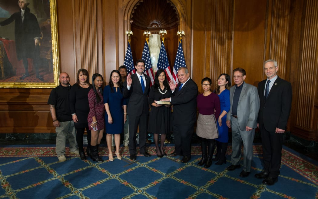 Congressman Gregorio Kilili Sablan is accompanied by family and supporters while being sworn in by U.S. House Speaker Paul Ryan.