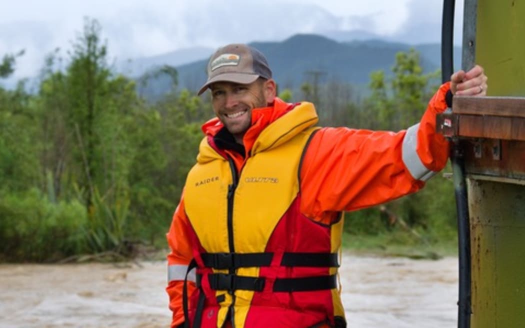 Hydrologist Chris Strang flood gauging the Wai iti River