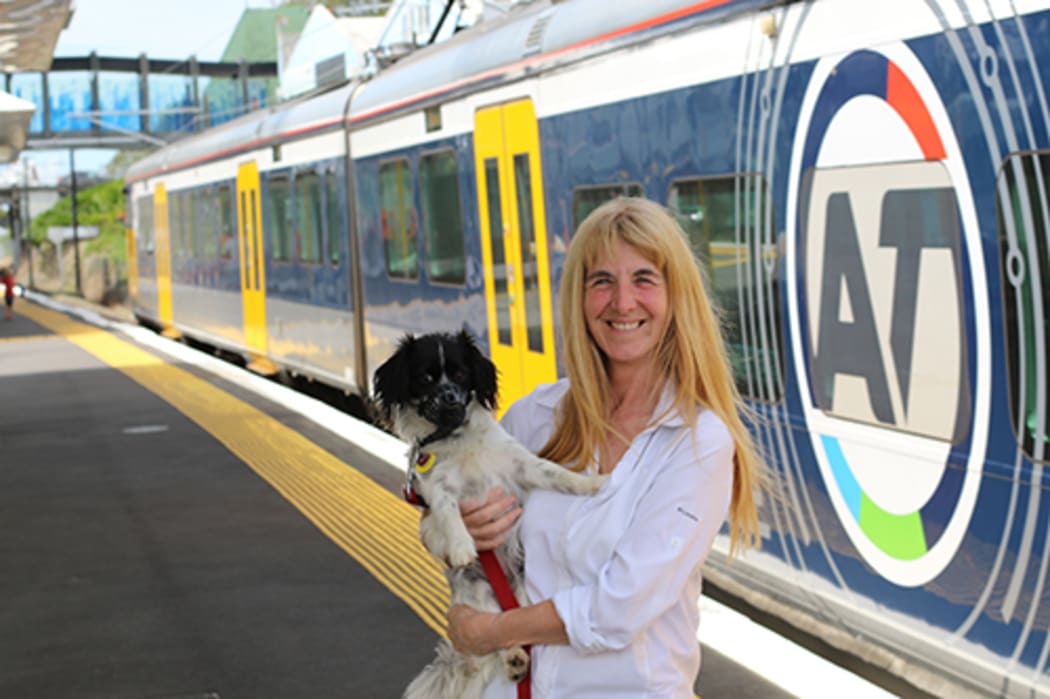 Councillor Cathy Casey with her dog Suzie on the train station platform.