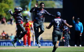 UAE bowler Amjad Javed celebrates the wicket of Hamilton Masakadza in Nelson