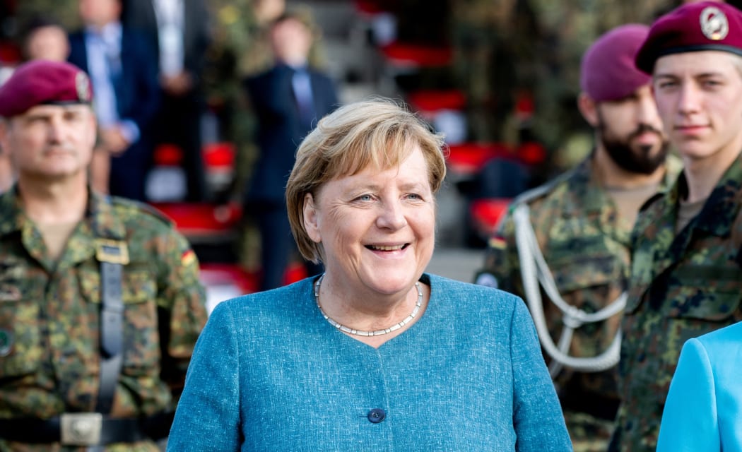German Chancellor Angela Merkel attends a recruits pledge during a military roll call of the military evacuation operation (MilEvakOp), in Seedorf, northern Germany on September 22, 2021.