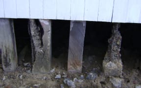 Rotting piles under a school in Daku Village, Fiji which suffers from seawater inundation