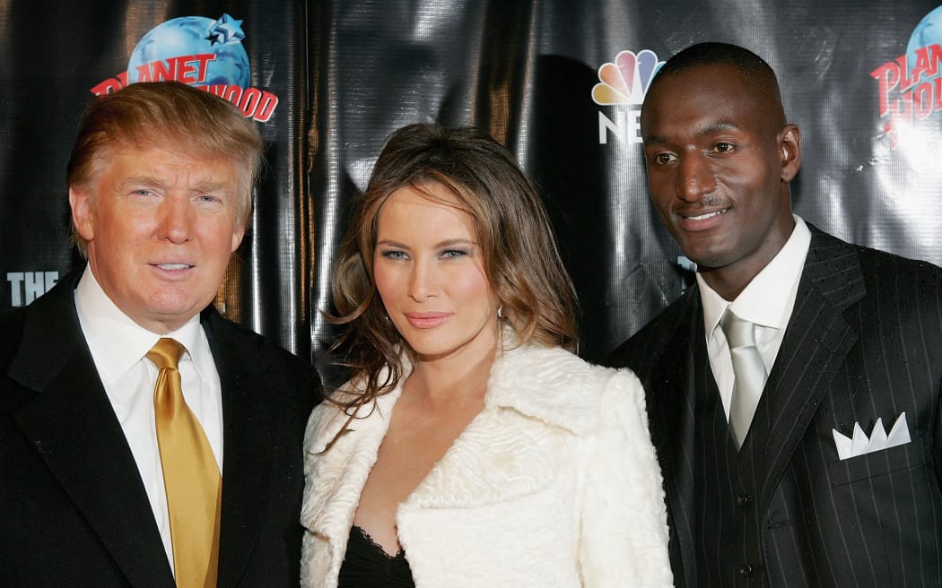 NEW YORK - DECEMBER 15:  Donald and Melania Trump pose with Randal Pinkett, the winner of "The Apprentice" season four during the after party at Planet Hollywood December 15, 2005 in New York City.  (Photo by Paul Hawthorne/Getty Images) *** Local Caption *** Donald Trump;Melania Trump;Randal Pinkett (Photo by Paul Hawthorne / Getty Images North America / Getty Images via AFP)