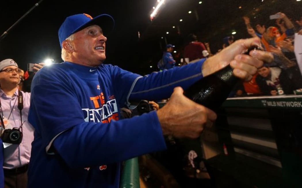 New York Mets manager Terry Collins celebrates on field after defeating the Chicago Cubs in game four at Wrigley Field on October 21, 2015 in Chicago. Elsa/Getty Images/AFP