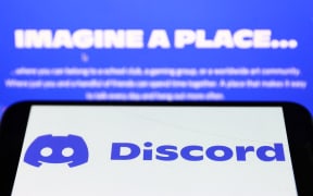 Discord logo displayed on a phone screen and Discord website displayed on a screen are seen in this illustration photo taken in Krakow, Poland on November 5, 2022. (Photo by Jakub Porzycki/NurPhoto) (Photo by Jakub Porzycki / NurPhoto / NurPhoto via AFP)

REDOWNLOADED 15/4/2023