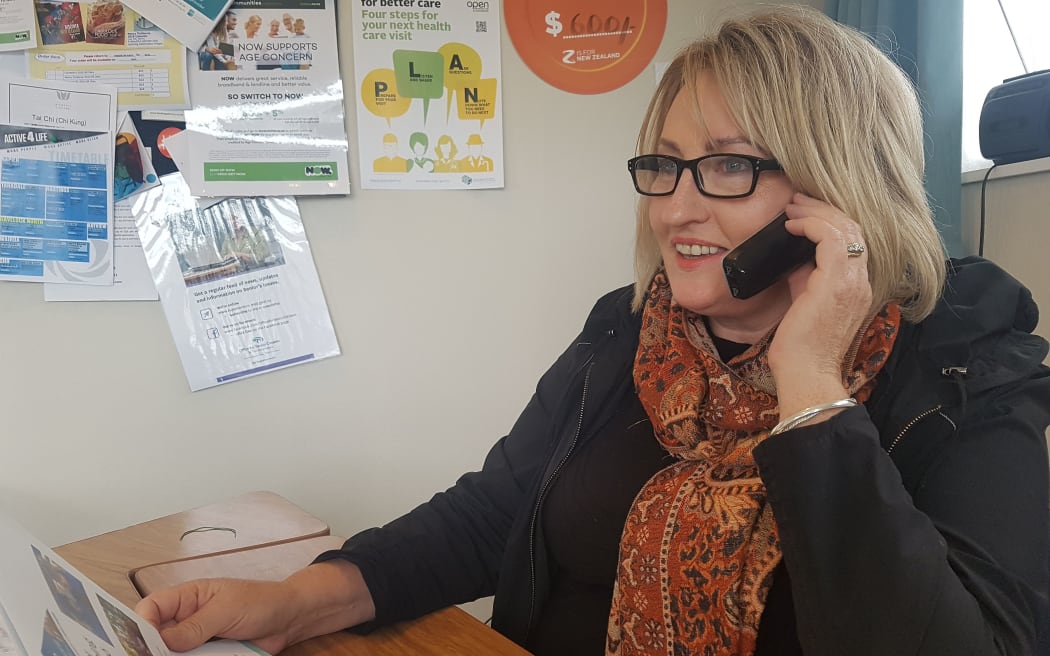 Woman on a phone at a desk