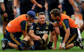 Ben Smith gets medical attention during the Highlanders match against the Chiefs.