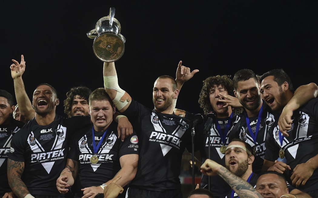 Simon Mannering captain of the Kiwis holds the Four Nations trophy.