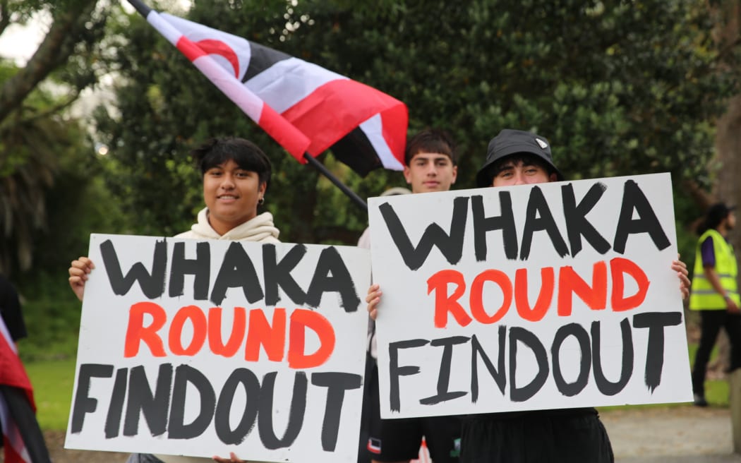 Ezekiel Hellesoe-Munroe, Nikau Beazely, Te Tahuri Hamilton (from left to right) pictured at the Hīkoi mō Te Tiriti in Tāmaki Makaurau.