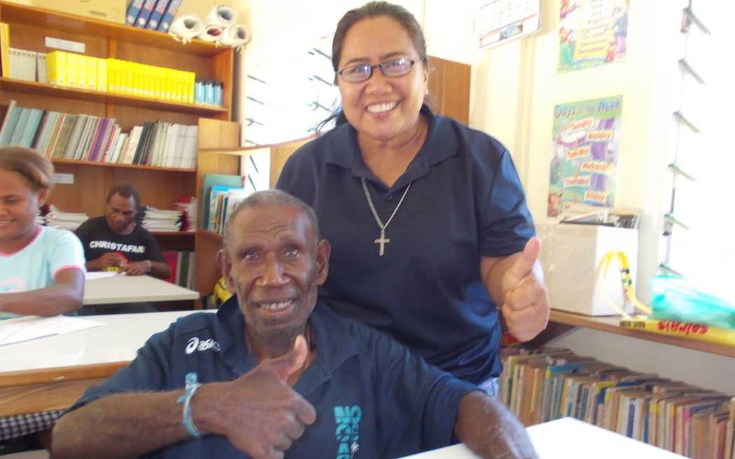 Sr Maria Fe Rollo with a student at San Isidro Care Centre in Honiara