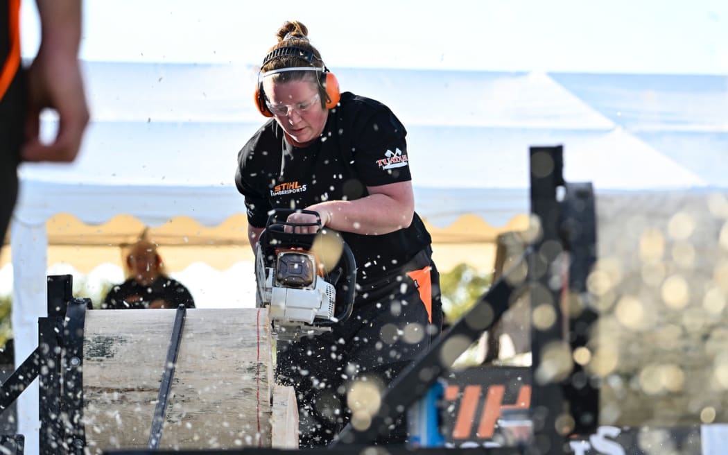 Emma Shaw competing in the stock saw event.