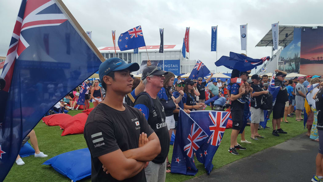 Team New Zealand fans cluster in front of the dockout show stage,