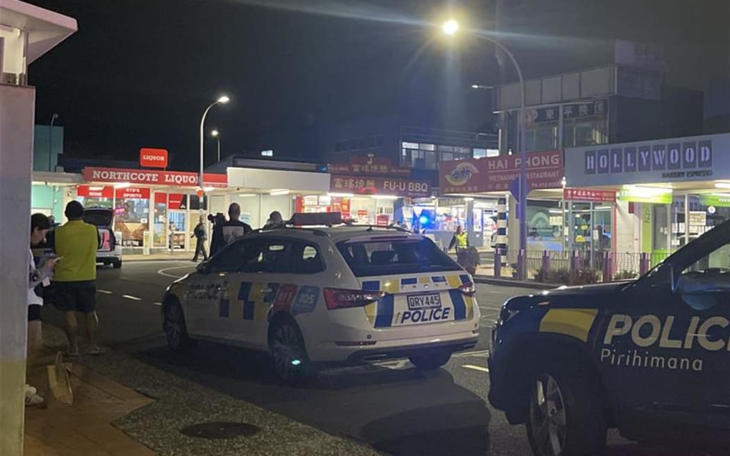Police took at least one person into custody after responding to an incident at Northcote Liquor, Pearn Crescent, Auckland, on 25 May, 2025.