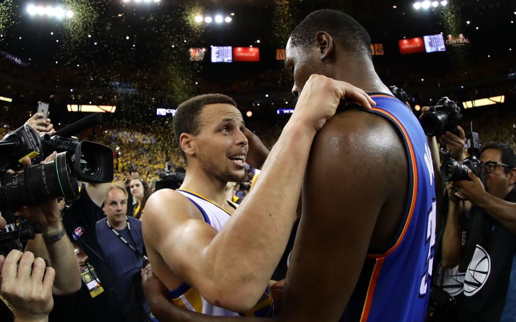Golden State's MVP Steph Curry speaks with Kevin Durant after the Warriors' 96-88 win in Game Seven of the Western Conference Finals during the 2016 NBA Playoffs in Oakland. Ezra Shaw/Getty Images/AFP 
EZRA SHAW / GETTY IMAGES NORTH AMERICA / AFP