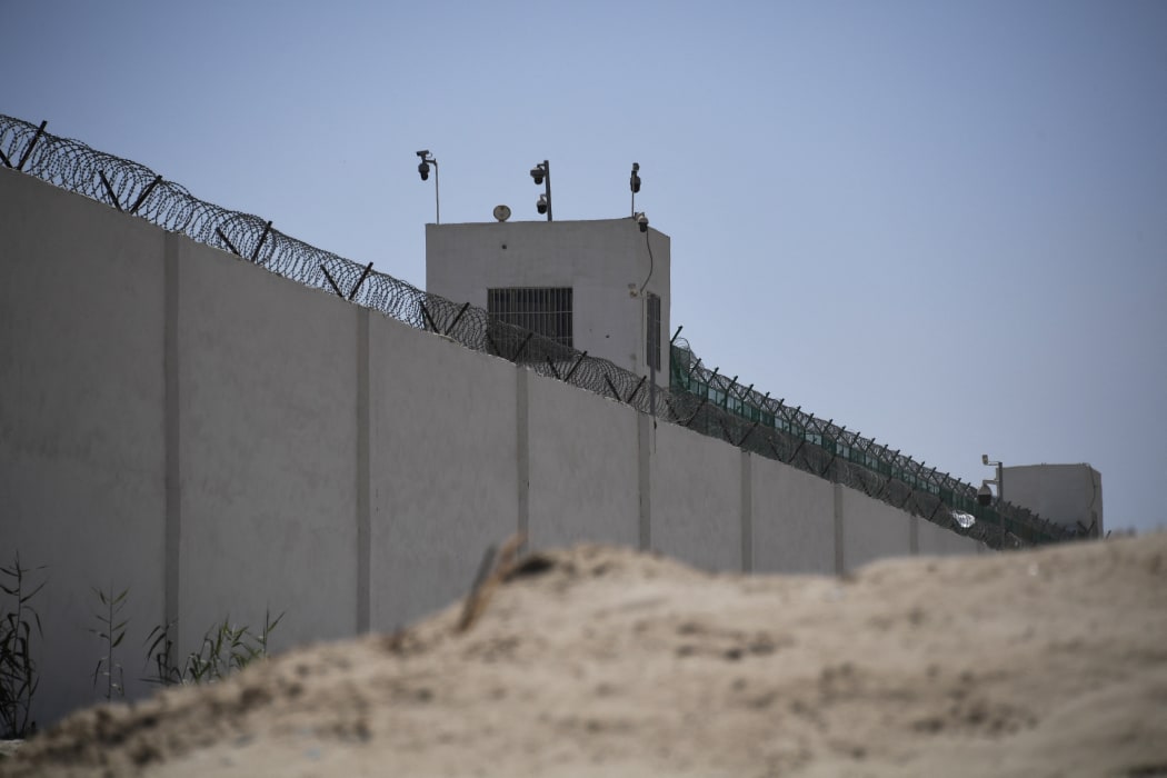 This photo taken on May 31, 2019 shows the outer wall of a complex which includes what is believed to be a re-education camp where mostly Muslim ethnic minorities are detained, on the outskirts of Hotan, in China's northwestern Xinjiang region.