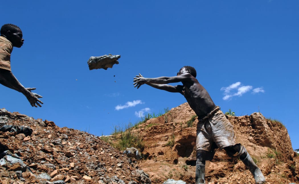A boy working in an open pit gold mine in Mongwalu, Democratic Republic of Congo, in 2008.