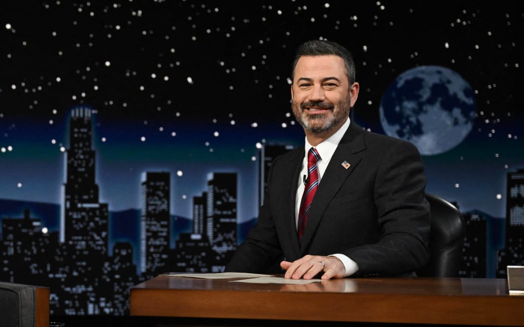 US President Joe Biden sits next host Jimmy Kimmel as he makes his first in-person appearance on "Jimmy Kimmel Live!" during his Los Angeles visit to attend the Summit of the Americas, in Hollywood, California, 8 June , 2022.