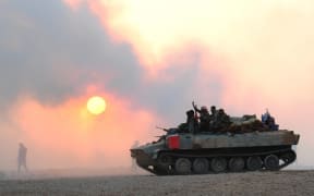 A tank in the city of al-Bukamal, an Islamic State stronghold in eastern Syria.