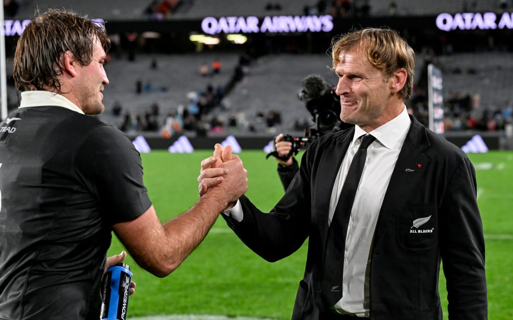 New Zealand coach Scott Robertson shakes hands with Ethan Blackadder.