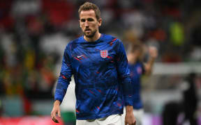 England's captain Harry Kane warms up ahead of the Qatar 2022 World Cup round of 16 football match between England and Senegal at the Al-Bayt Stadium in Al Khor, north of Doha on 4 December, 2022.