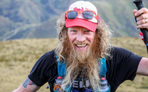 Aucklander Shaun Collins -- aka the ''Running Beast' -- is running around the residential perimeter of Auckland.