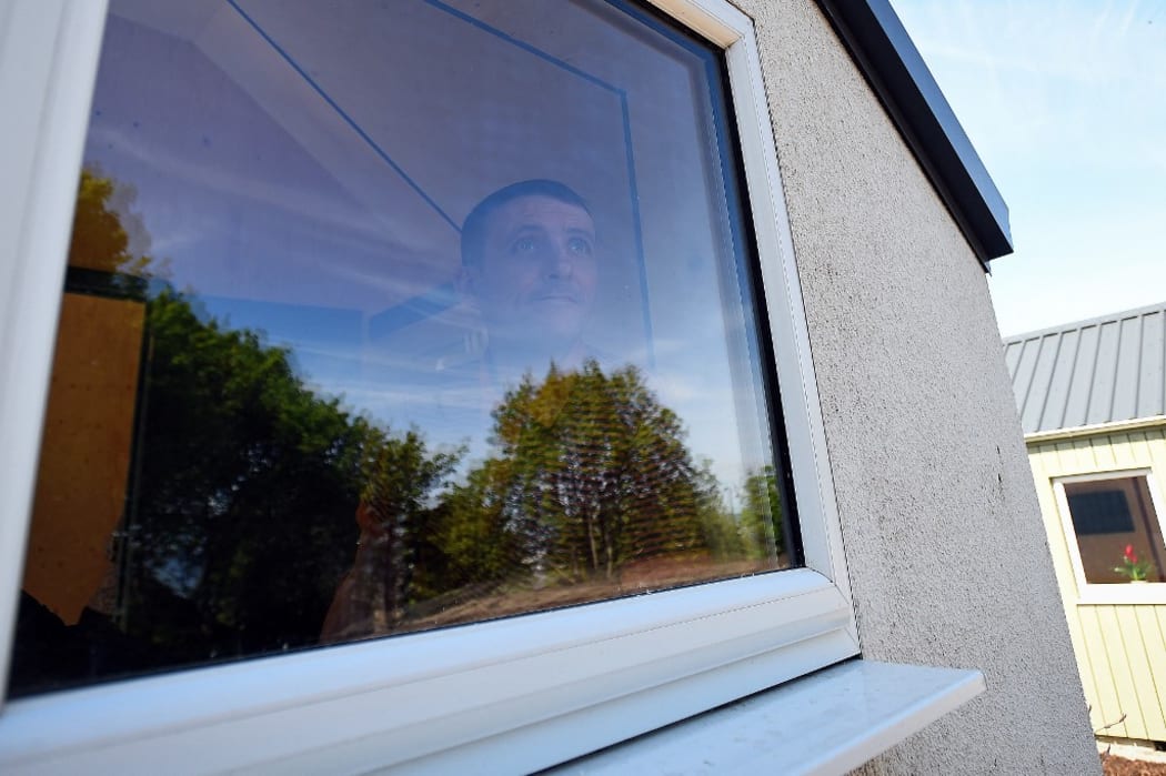 Social Bite worker, Sonny Murray, who was homeless, has a look around the newly completed village buildings during the launch of the Social Bite Village project in Granton, Edinburgh