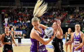 Charlie Bell of the Stars and Karin Burger of the Tactix tussle for the ball during their ANZ Premiership Netball match at Wolfbrook Arena, Christchurch, 22th June 2025. Copyright photo: John Davidson / www.photosport.nz