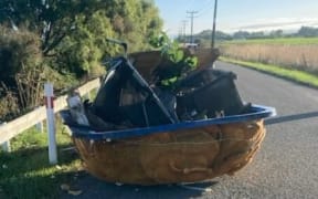 A discarded spa pool left in the middle of a Palmerston North road.
