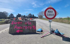 The other route into the industrial zone via Awatoto Road is closed. Residents are volunteers have been bringing trailer load after trailer load of waste and ruined furniture to an informal dump site on the corner of Eriksen and Awatoto roads. They say the local council knows about it and plans to clear it.
