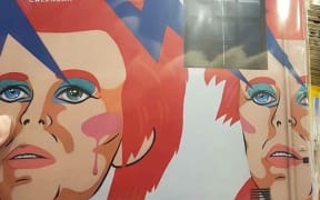 Wellington mural artist Xoë Hall is outraged photos of her work have appeared in a calendar without permission.