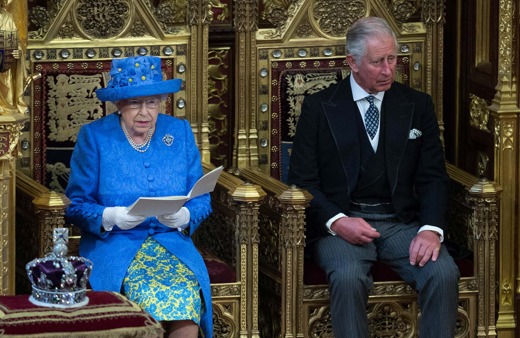 The Queen sits alongside Prince Charles as she delivers the Queen's Speech.
