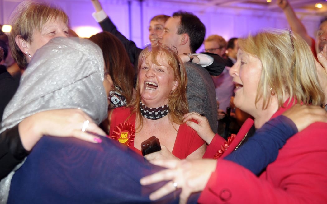 Pro-union supporters celebrate during a 'Better Together' referendum event in Glasgow.