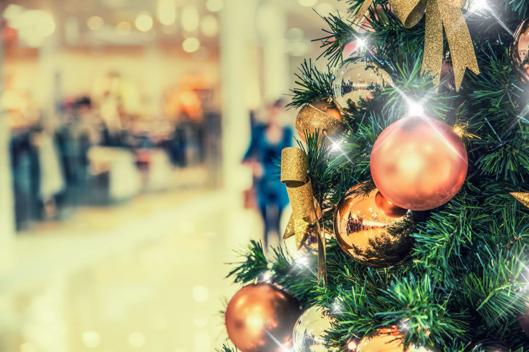 Christmas tree with gold decoration in shopping mall.Christmas clearance sales at the shopping mall.