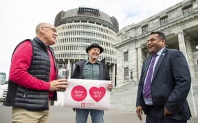President of the Restaurant Association Mike Egan (L) and Association Vice President Steve Logan deliver lunch to Minister Kris Faafoi at Parliament, Wellington, Tuesday 25 August 2020. Credit: Hagen Hopkins.