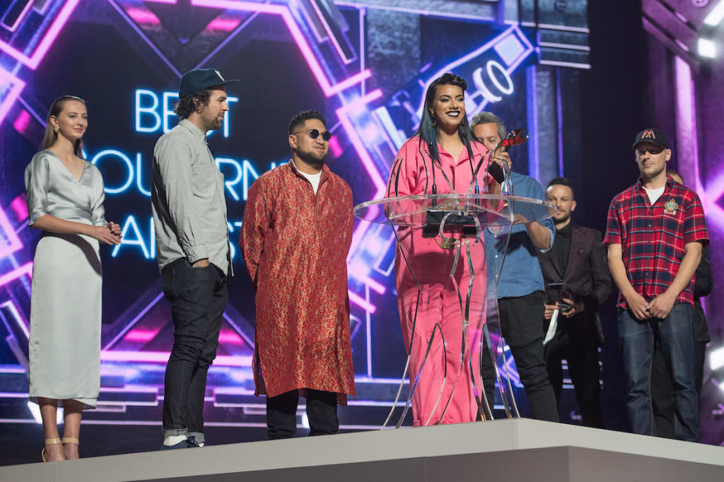 Ladi6 and band accept the Tui for Best Soul/RnB act