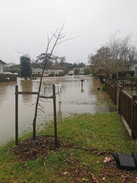 Street in Auckland's Huapai that flooded during severe weather, meaning a number of residents were accepted for council buy-out.