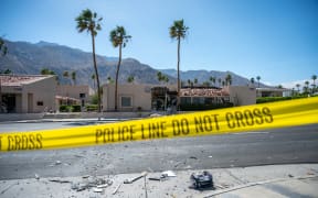 A police line is seen outside a damaged American Reproductive Centers fertility clinic after a bomb blast outside the building in Palm Springs, California, on May 17, 2025. A bomb blast outside a California fertility clinic killed one person Saturday, in what the US attorney general called an "unforgivable" attack. The blast ripped through downtown Palm Springs, badly damaging the clinic and blowing out the windows and doors of other nearby buildings. (Photo by Gabriel Osorio / AFP)