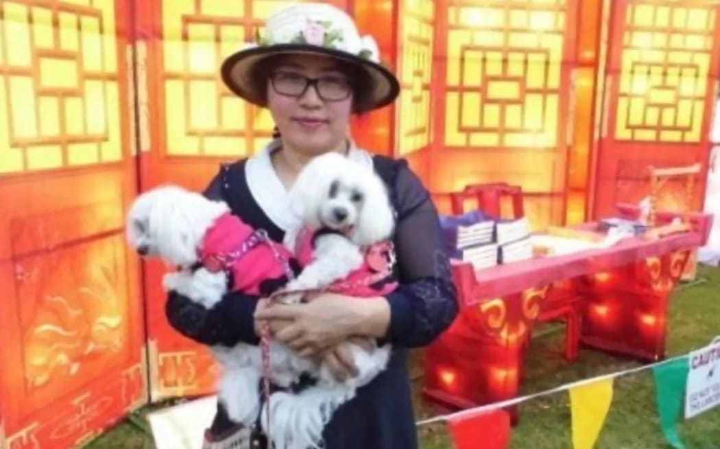 Elizabeth Zhong, pictured with her dogs in 2014.
