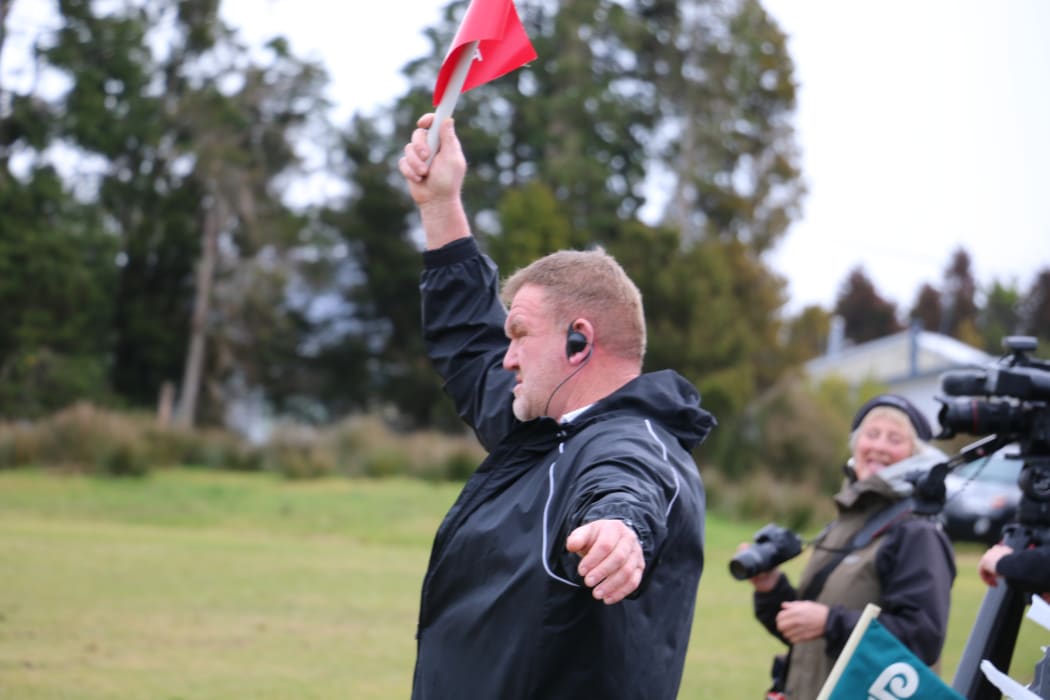 Gary MacRae as touch judge for the Woodham Shield final