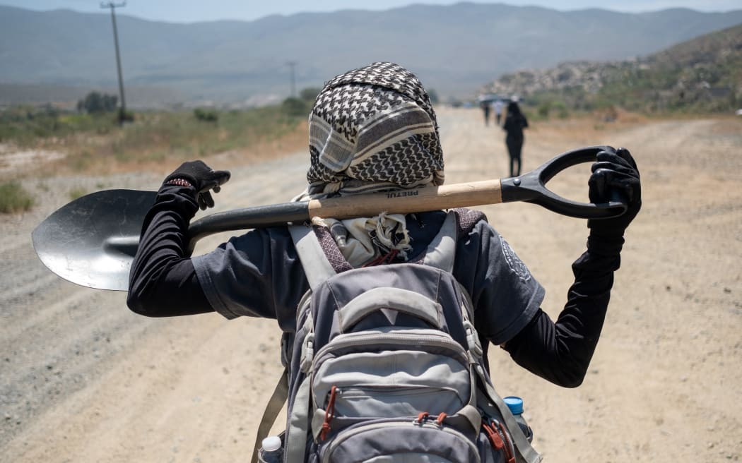 Tranquilina Hernandez, whose daughter disappeared in 2014, takes part in a collective search in Valle de las Palmas, outskirts Tijuana, Baja California state, Mexico, on 28 April, 2023. - According to a latest official report released in May by Mexican government, more than 100,000 people have disappeared in Mexico since 1964.