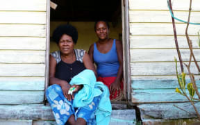Two residents of Nadalei Village, in the remote interior of Fiji's Viti Levu Island. The village was hard hit by Cyclone Winston.