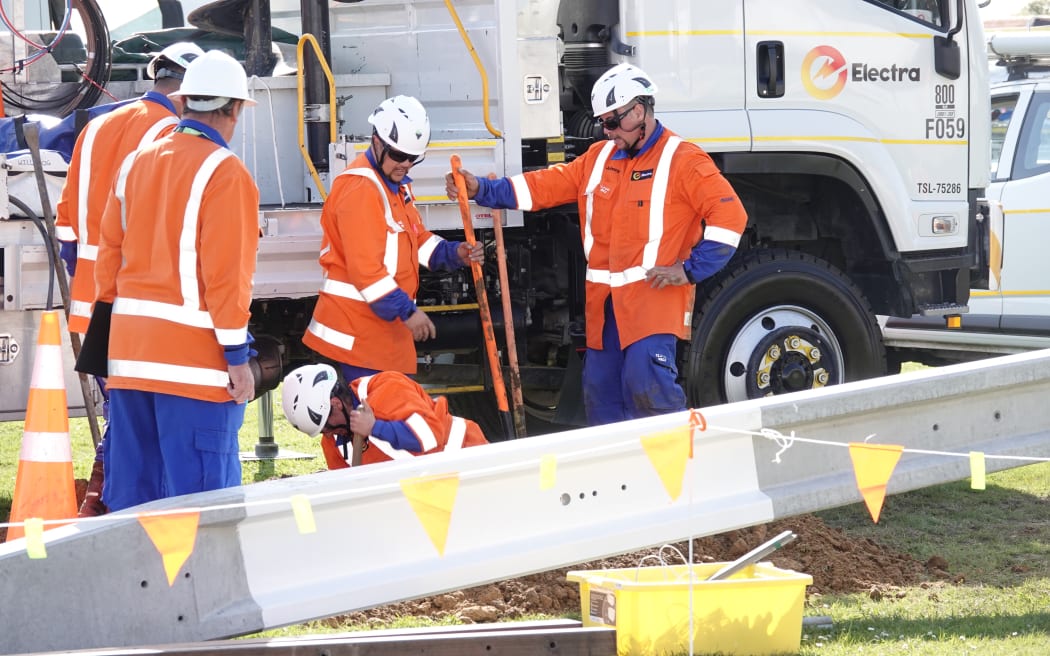 Annual Connection competition teams put up power poles.
