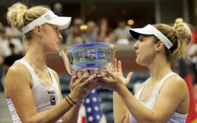 New Zealand's Erin Routliffe and Canada's Gabriela Dabrowski celebrate with the trophy following the US Open tennis tournament women's doubles final match, 2023.